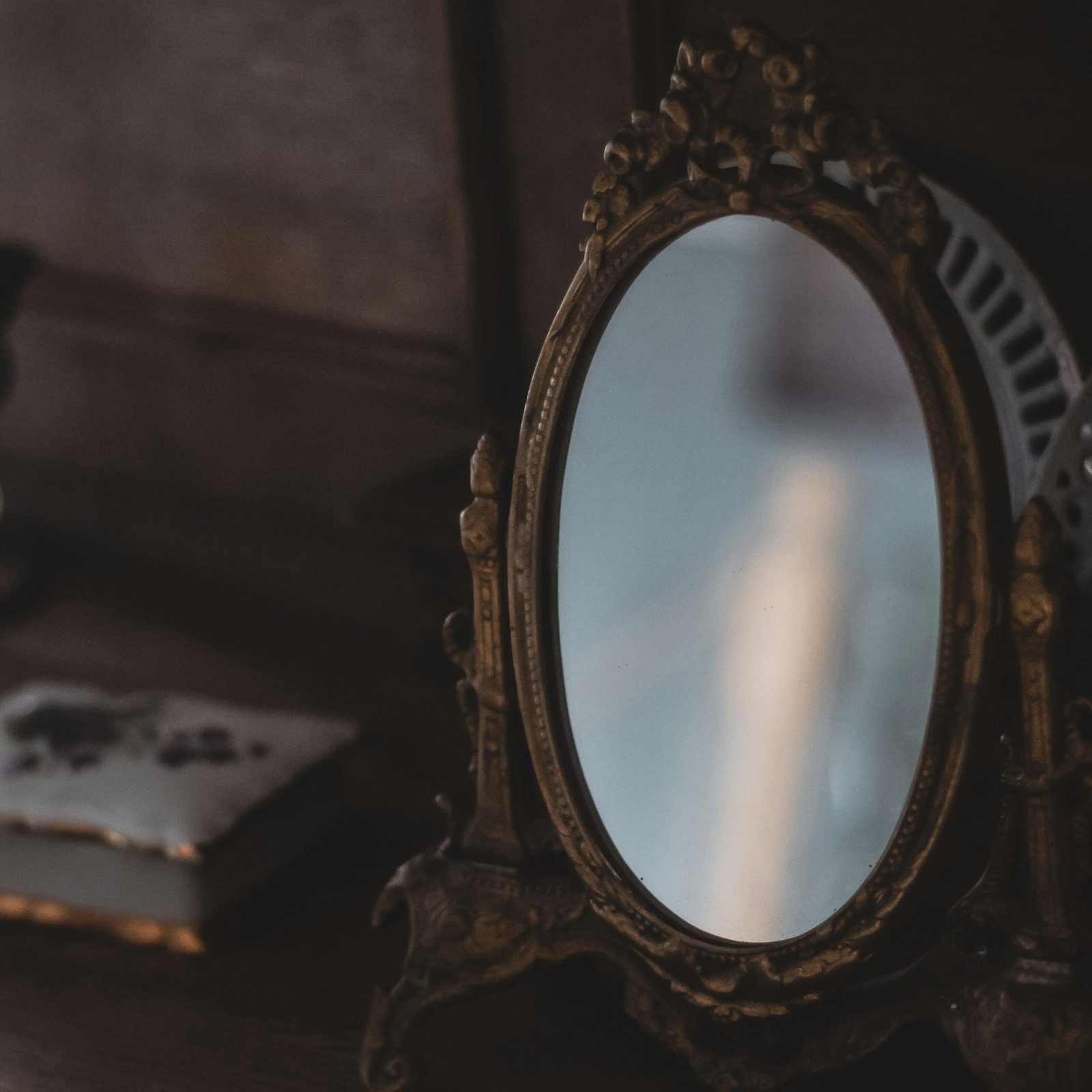 Ornate mirror on a wooden table
