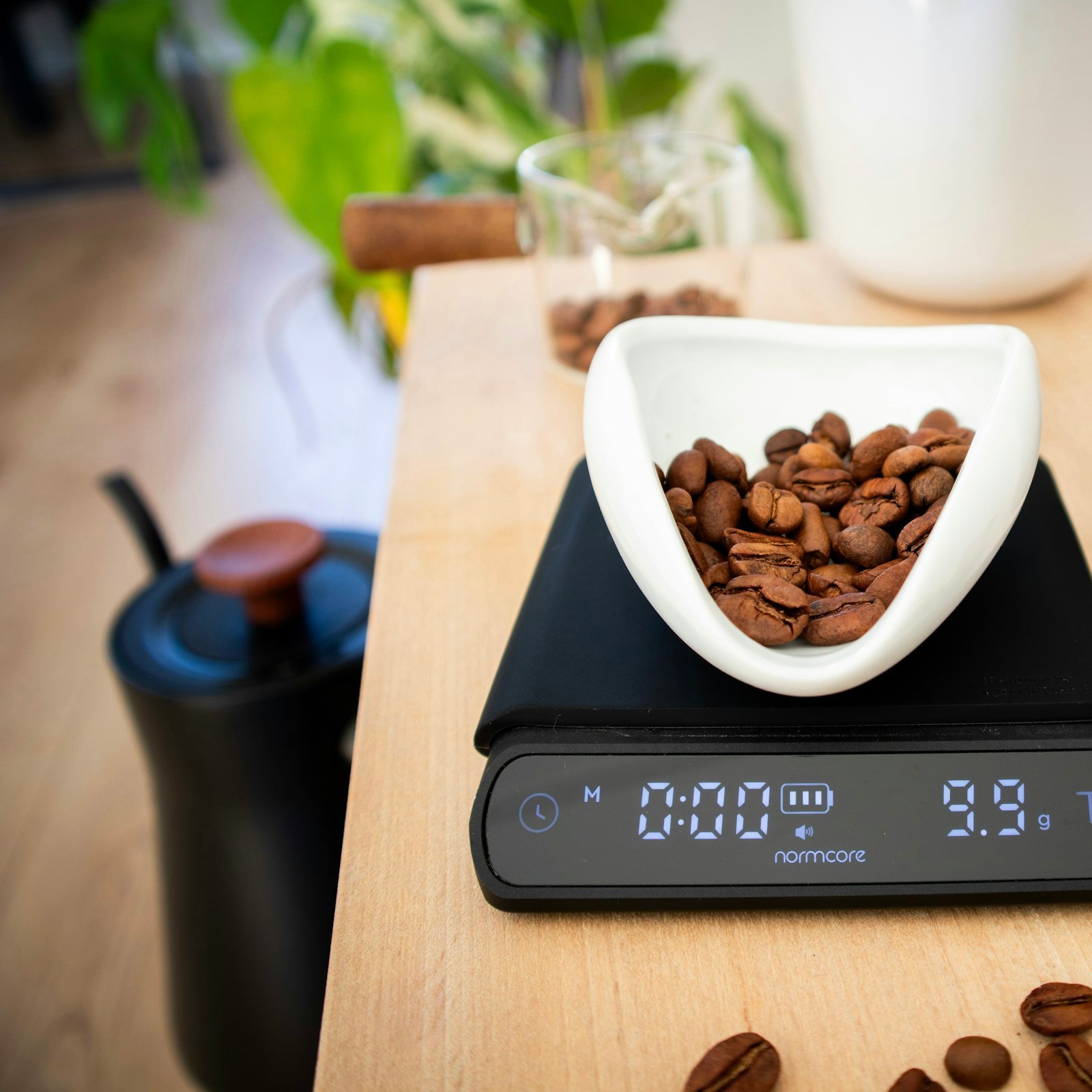 Digital kitchen scale weighing coffee beans
