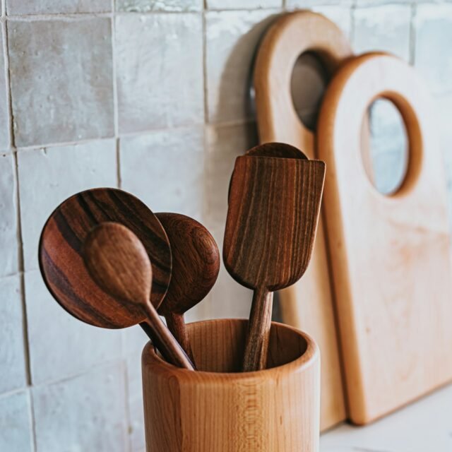 Wooden kitchen utensils in a wooden holder