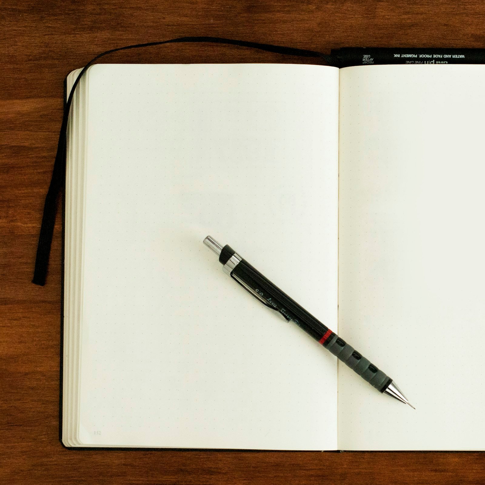 Notebook with a pen on blank pages
