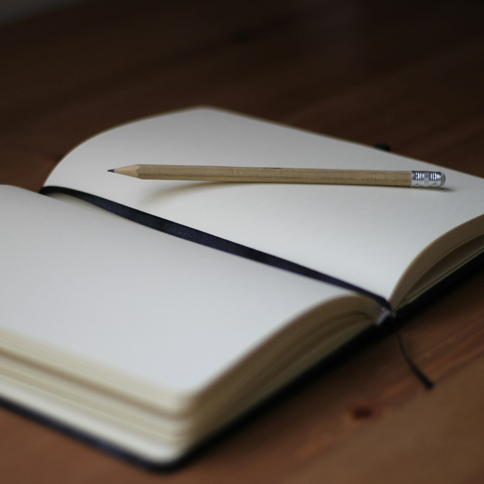 Hardcover notebook with a pencil