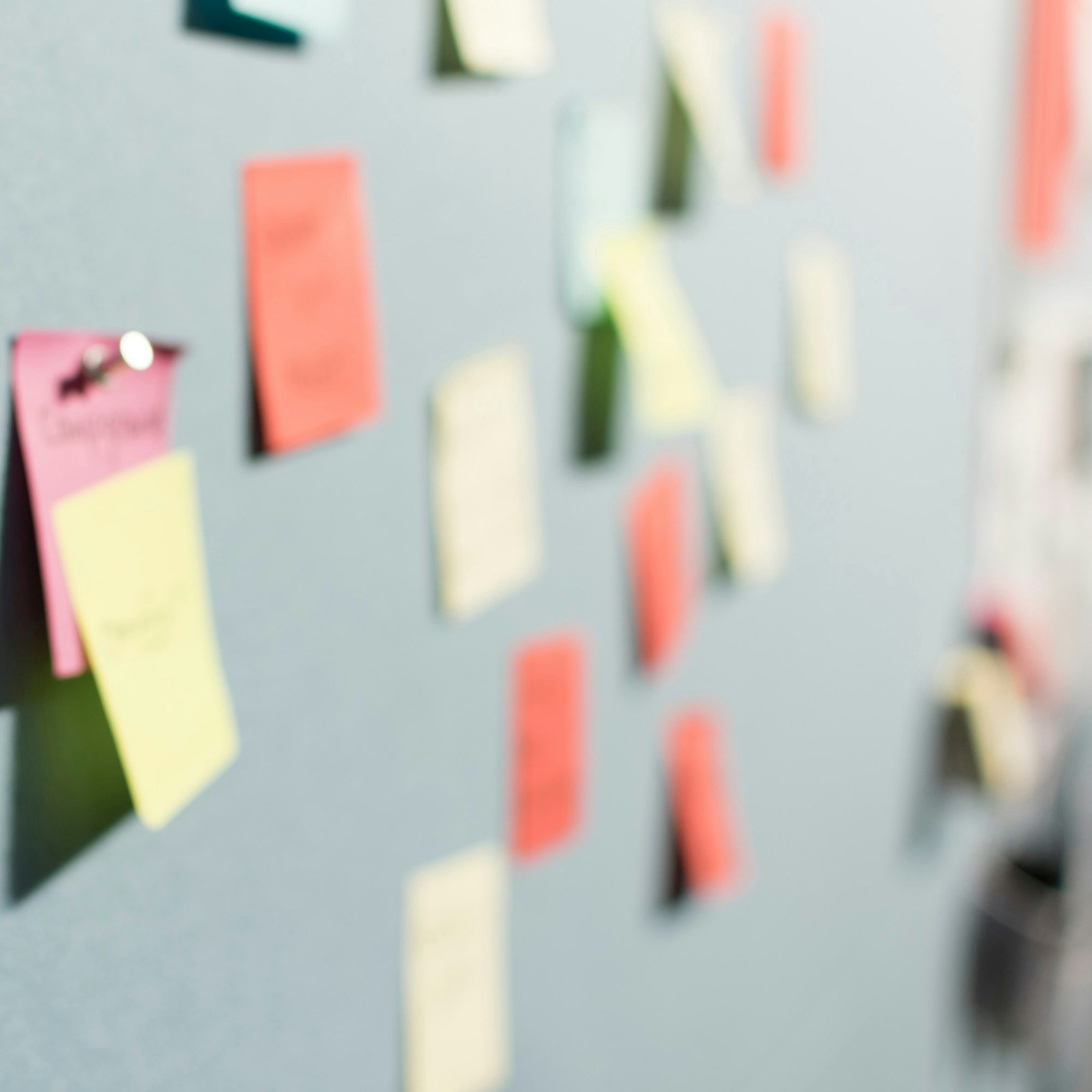 Colorful sticky notes on a board
