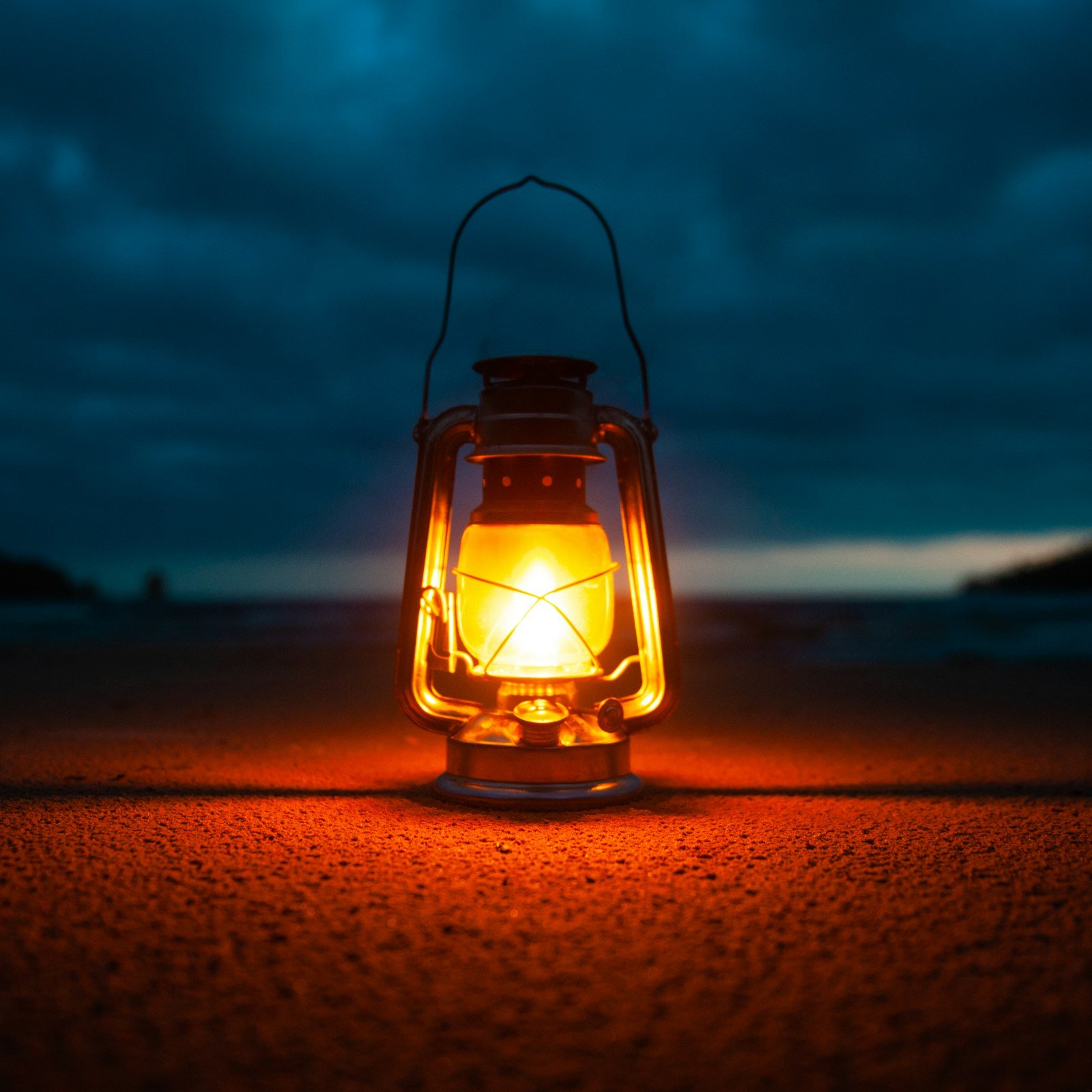Lit lantern outdoors at night