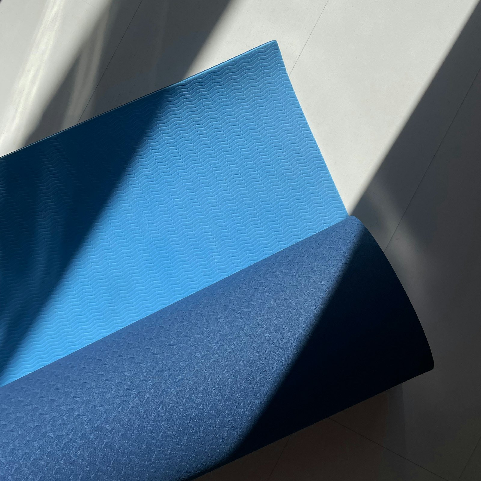 Textured exercise mat surface