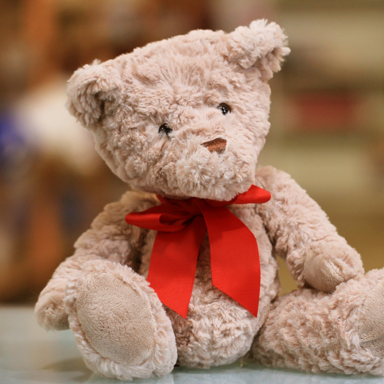 Classic teddy bear with a red bow